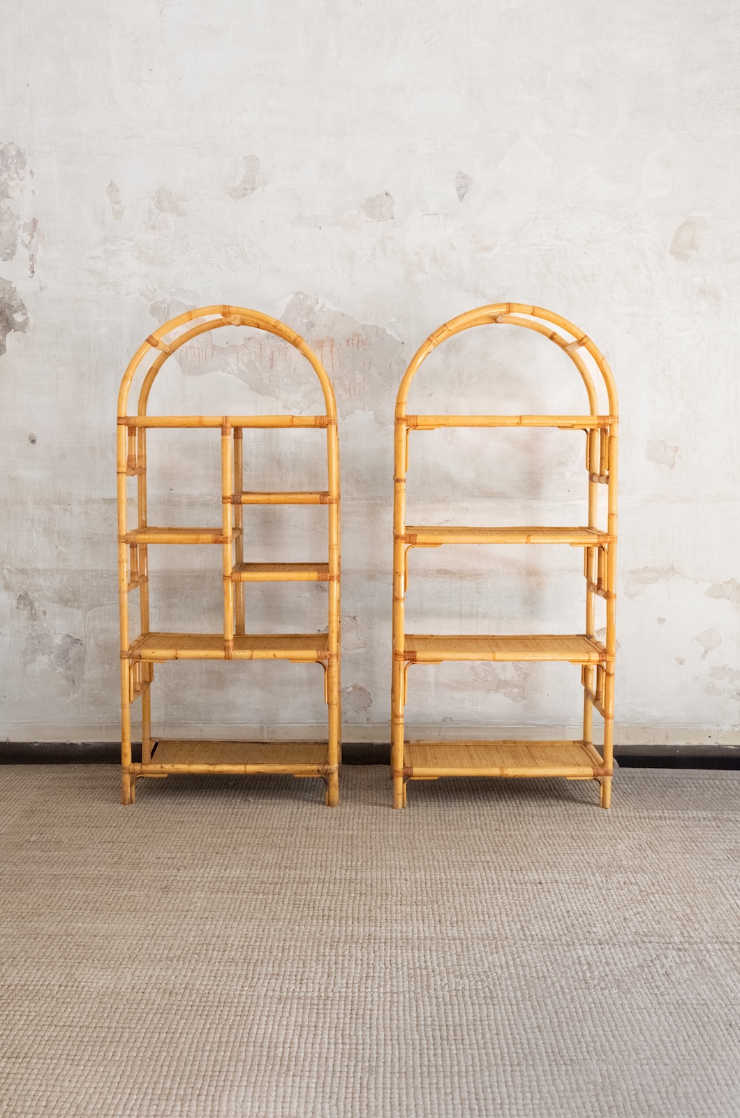 Pair of arched bamboo bookcases with woven rush fabric – 1970s