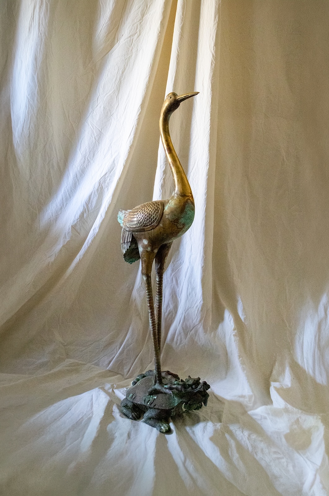 brass heron sculpture