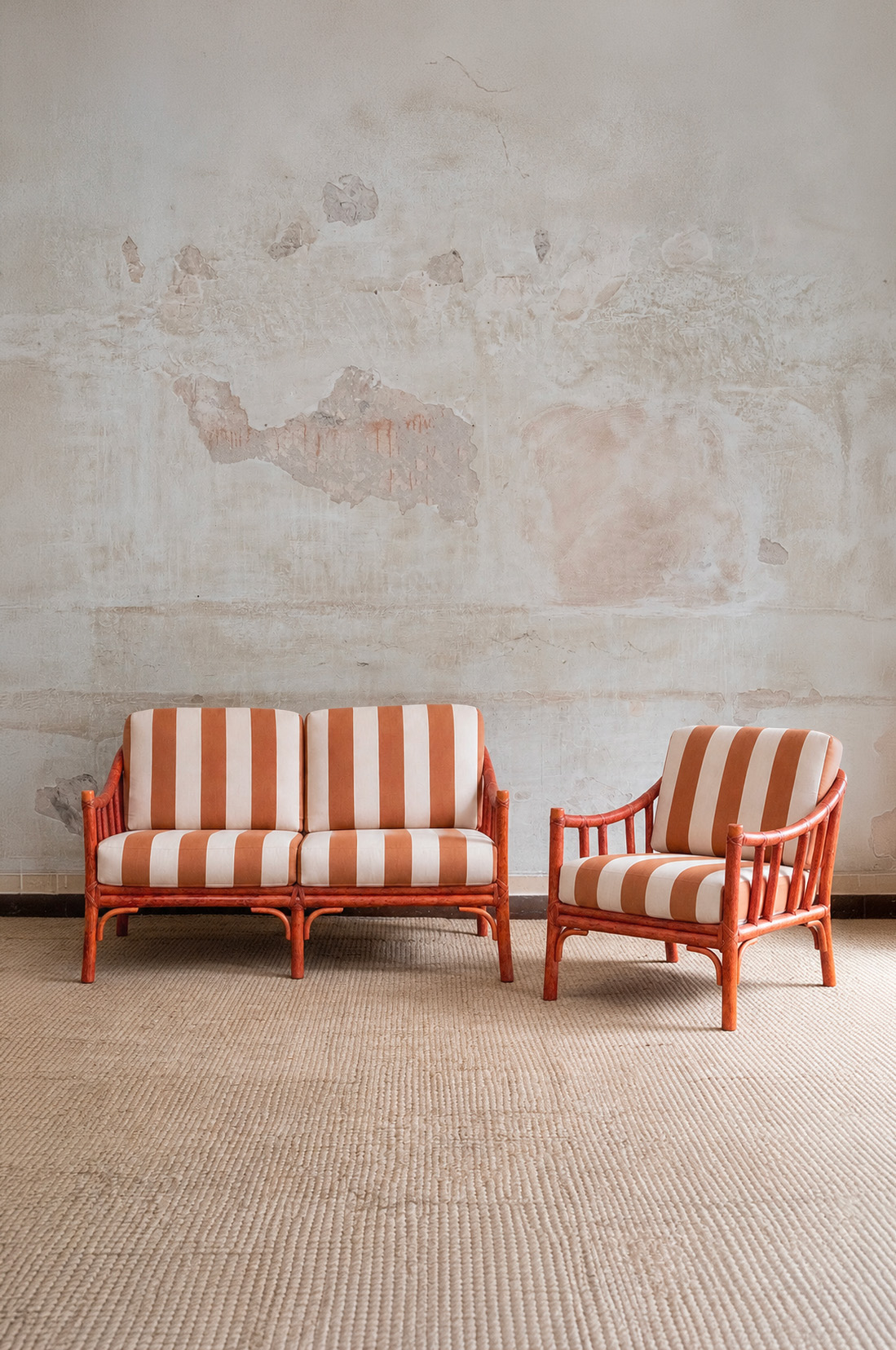 1970s vintage two-seater rattan sofa with orange and ivory striped upholstery